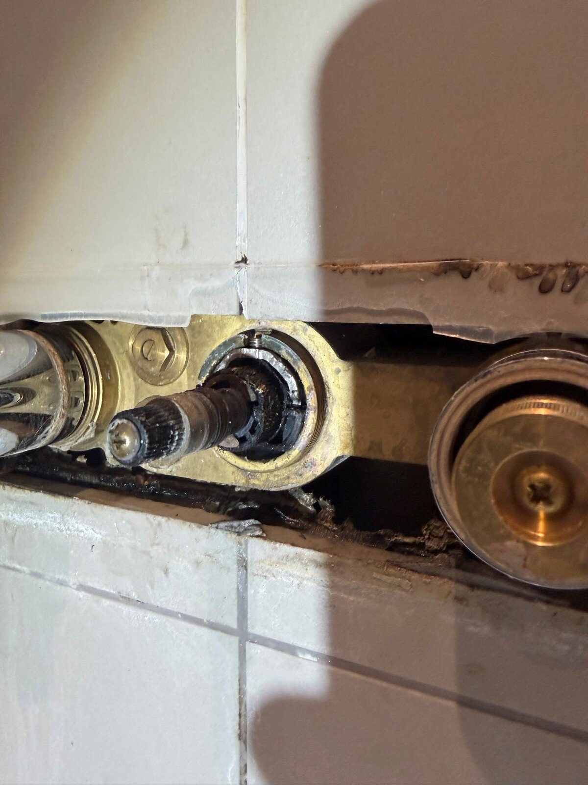 Shower valve repair carried out by plumber in Epsom home