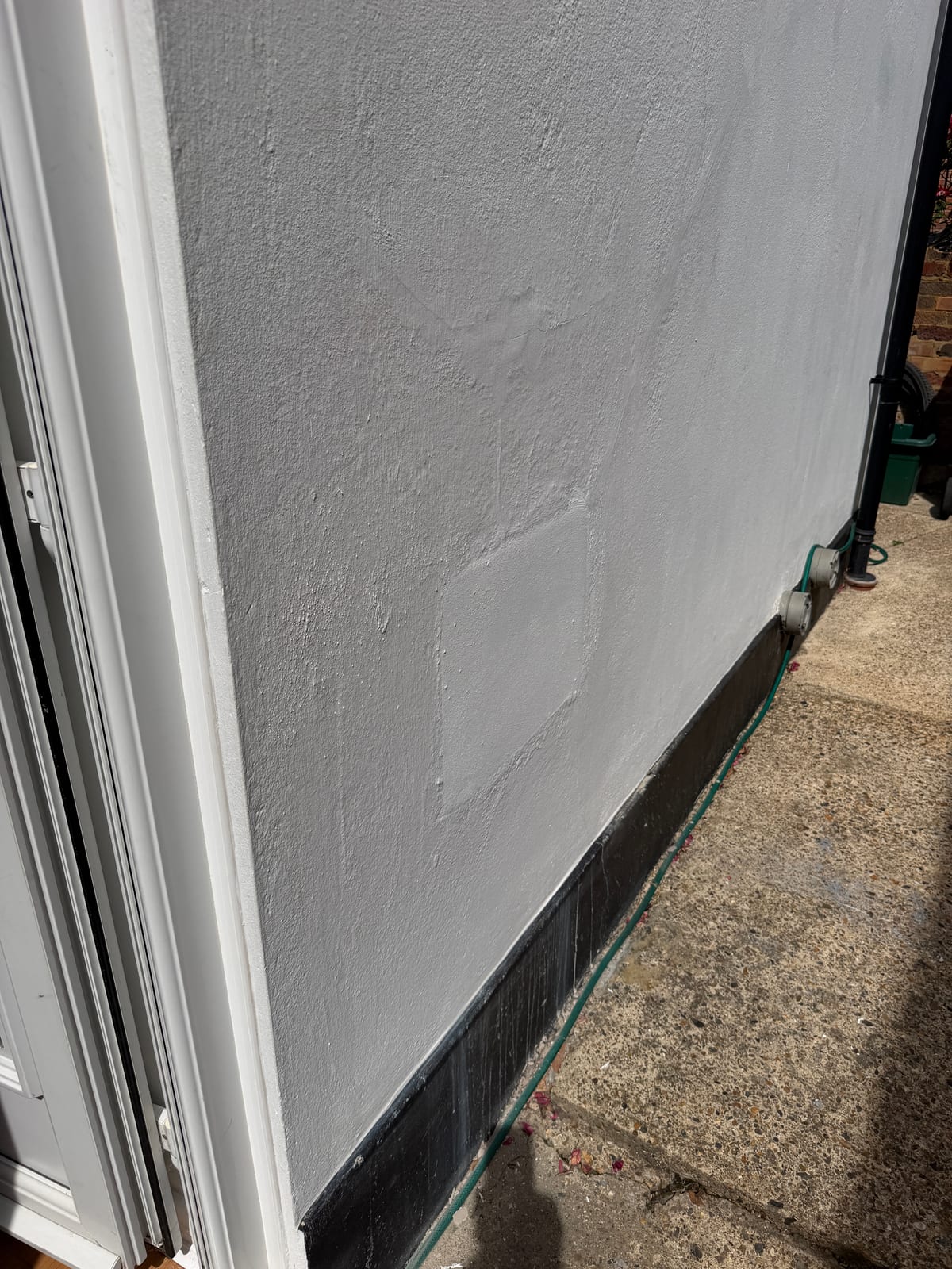 External wall made good, painted and old boiler flue opening sealed after an Epsom boiler replacement