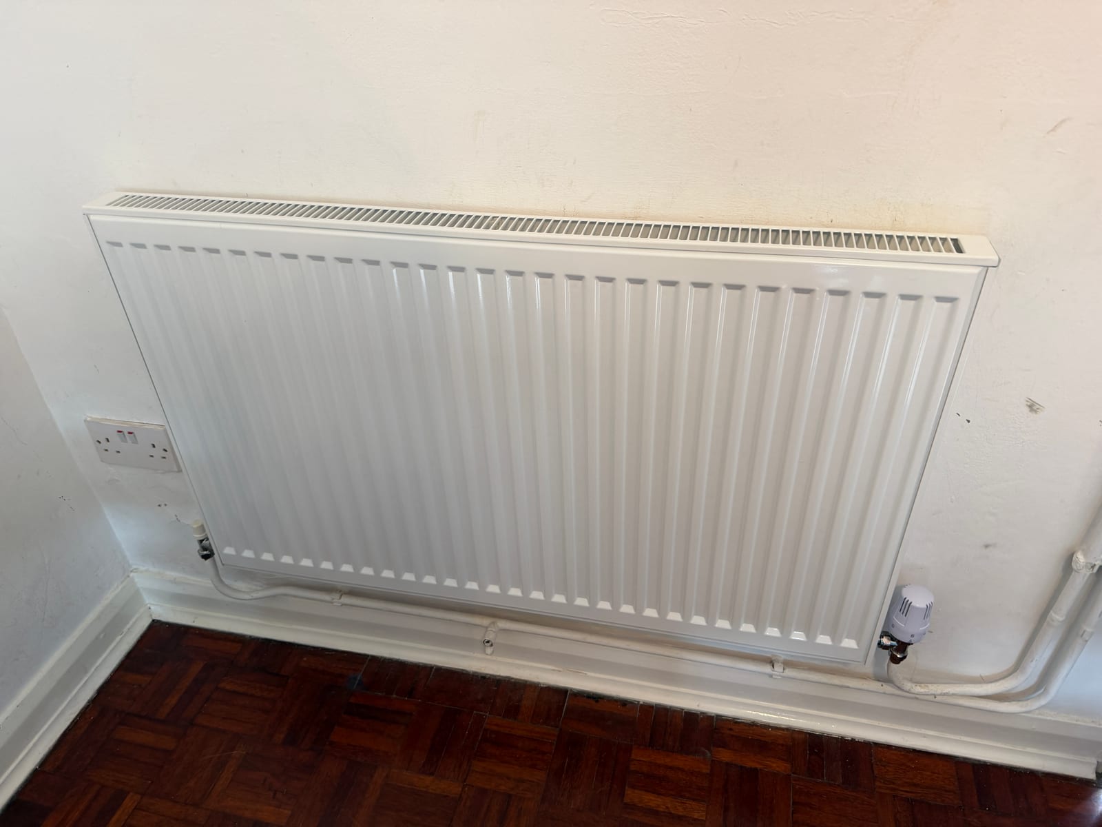 New replacement radiator fitted as part of an Epsom heating system upgrade