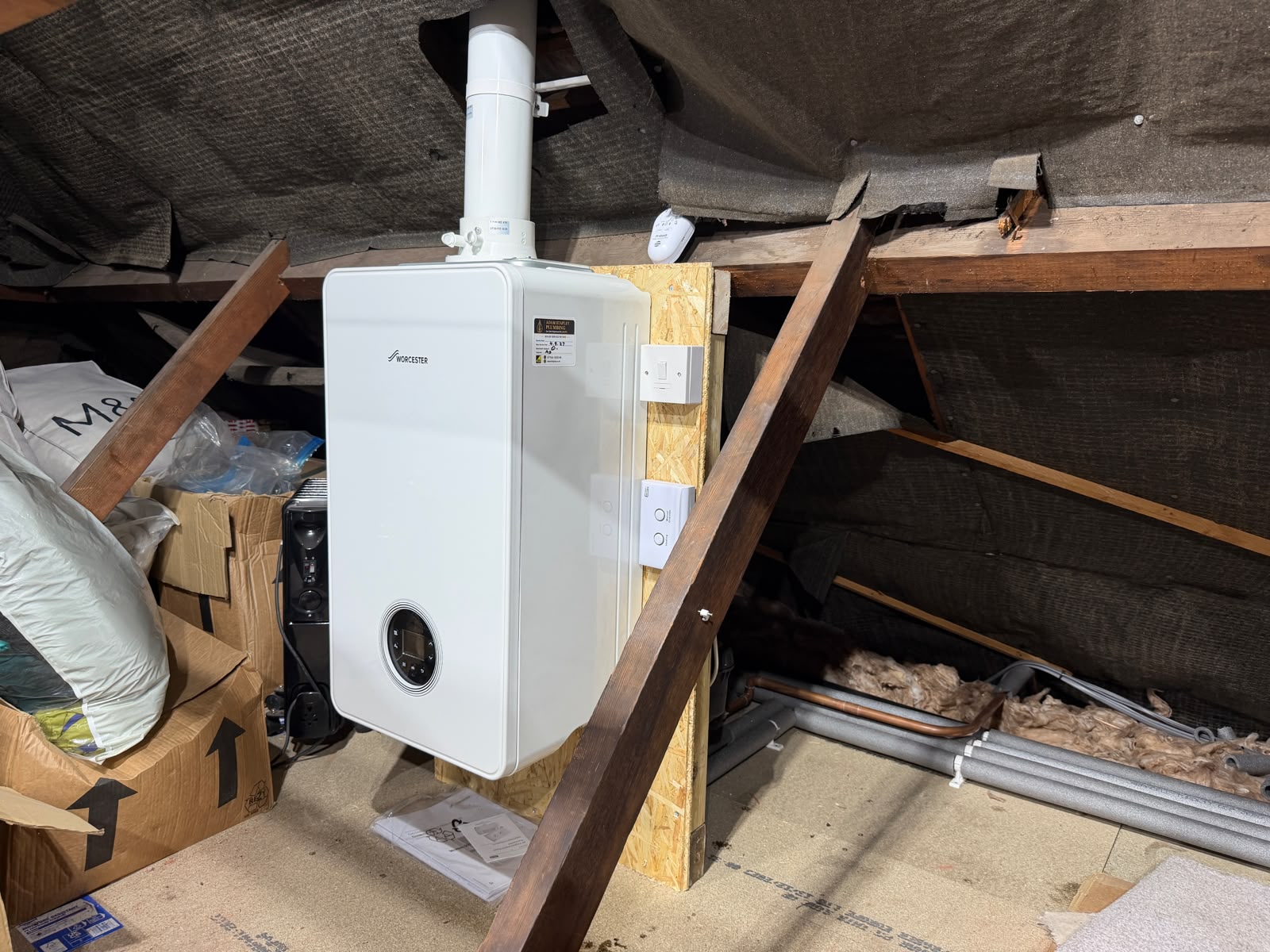 Finished loft boiler installation and pipework in Ewell