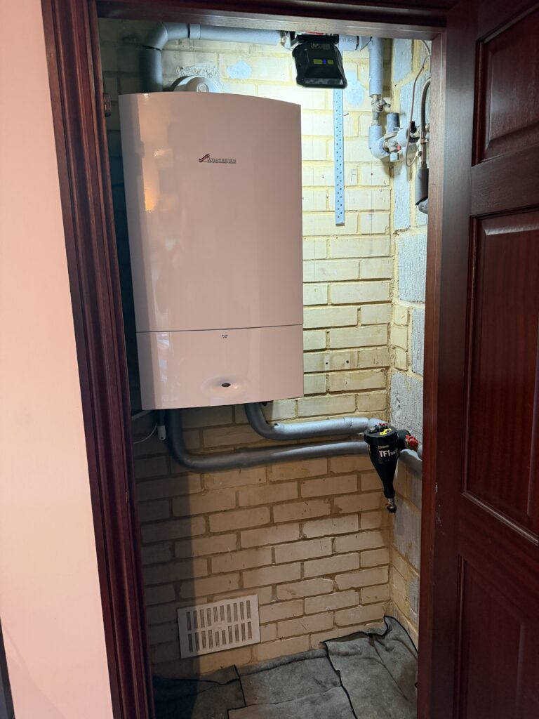 Existing 18-year-old Worcester system boiler before replacement in Cheam