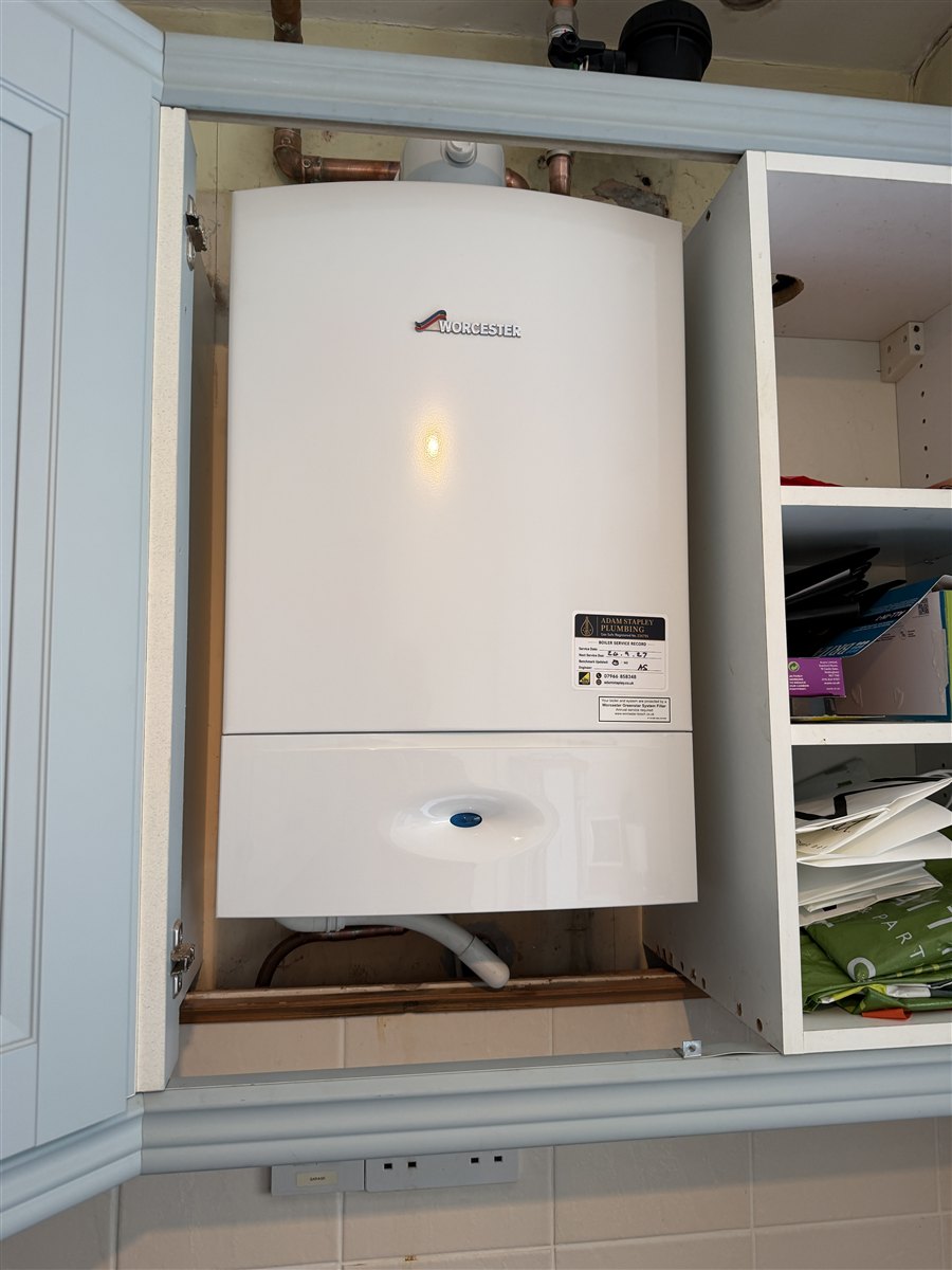 Worcester 27Ri fitted in place of an Ideal boiler in an Epsom kitchen cupboard